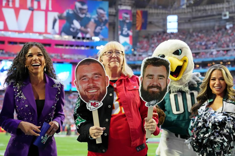 Donna Kelce holds up photos of her sons, Kansas City Chiefs tight end Travis Kelce and Philadelphia Eagles center Jason Kelce before Super Bowl LVII on Feb. 23, 2023, at State Farm Stadium in Glendale, Arizona. Mandatory Credit: Kirby Lee-USA TODAY Sports