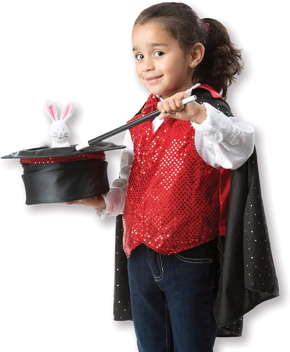 Kid in a magician costume