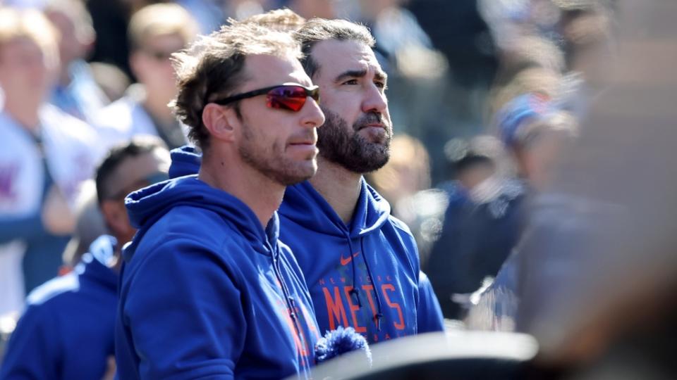 Apr 9, 2023;  New York City, New York, USA;  New York Mets starting pitchers Max Scherzer (left) and Justin Verlander stand together in the dugout during the seventh inning against the Miami Marlins at Citi Field.