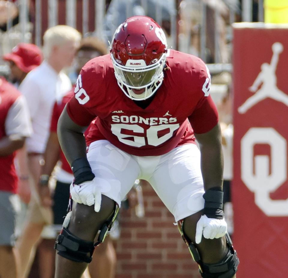 The Dallas Cowboys held the No. 24 pick in Thursday night's NFL draft but liked five players when it was time for their choice, so they traded down five spots, picked up an extra third-rounder and selected Oklahoma tackle Tyler Guyton.