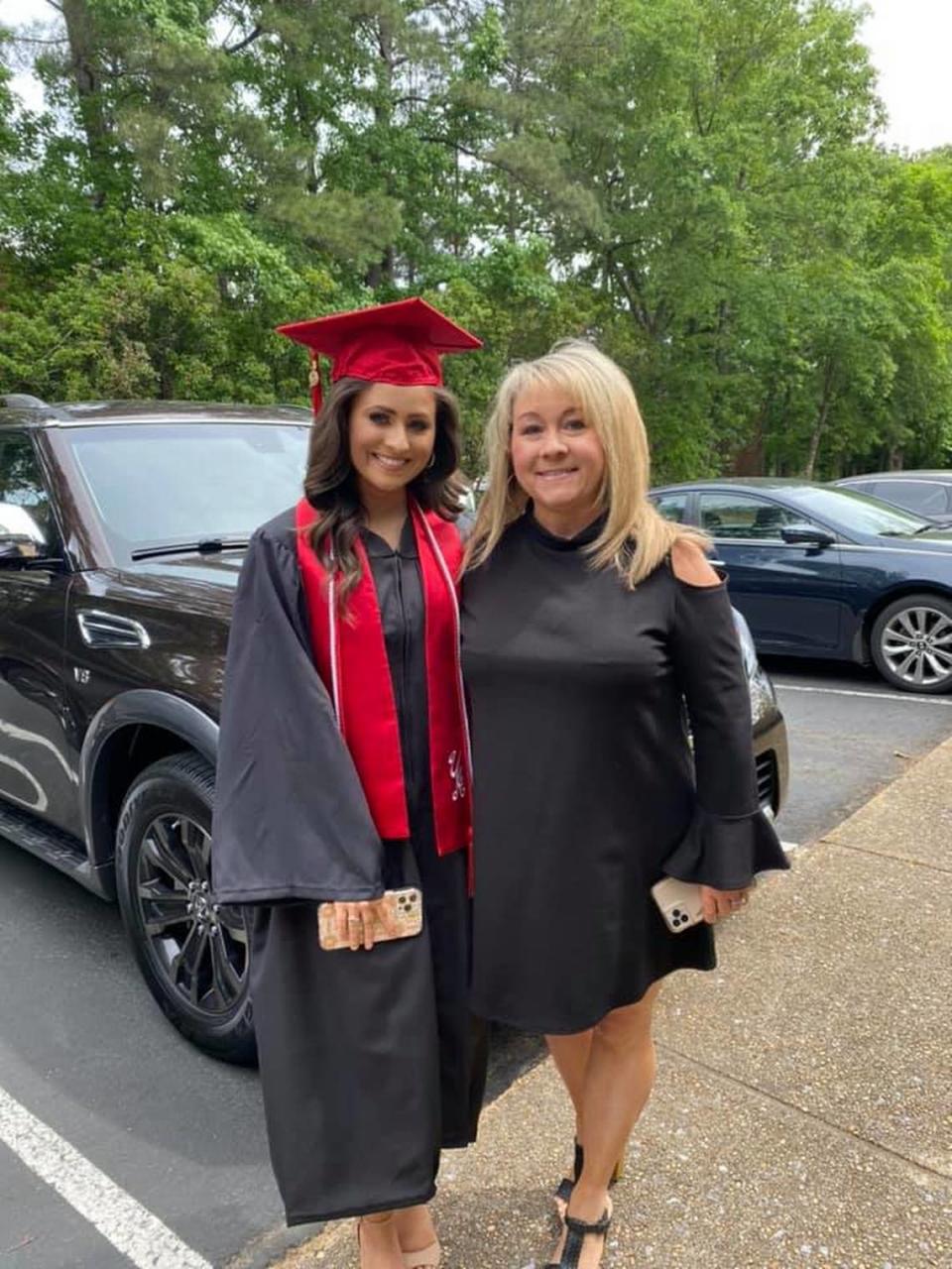 Holly Brand (pictured with mom, Connie) graduated from the University of Alabama.