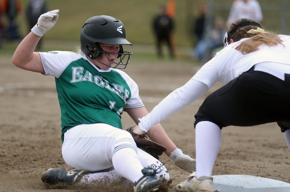 Klahowya's Ella Bottalico is safe at third ahead of the tag by Kingston's Kiera Chaussee on Friday, March 18, 2022.