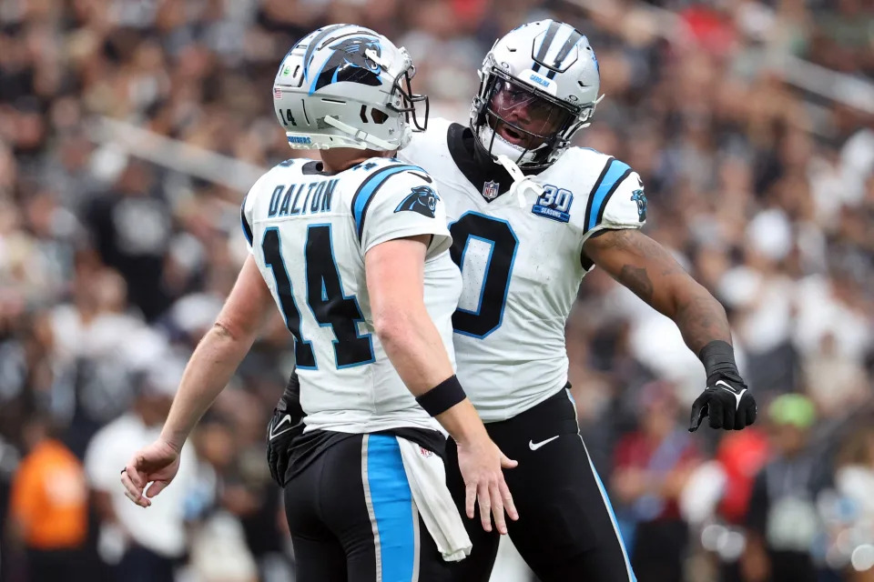  Andy Dalton #14 and Ja'Tavion Sanders #0 of the Carolina Panthers celebrate during the second quarter against the Las Vegas Raiders at Allegiant Stadium on September 22, 2024 in Las Vegas, Nevada. (Photo by Ian Maule/Getty Images)