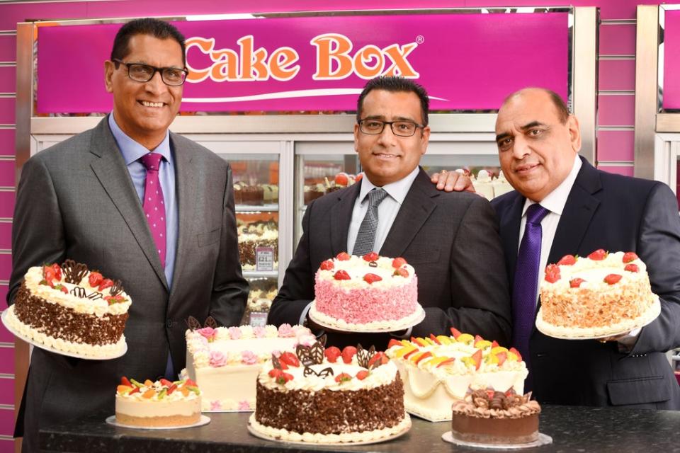 Sukh Chamdal (left) and Pardip Dass (centre) launched the Cake Box franchise in 2009 (Cake Box/PA)