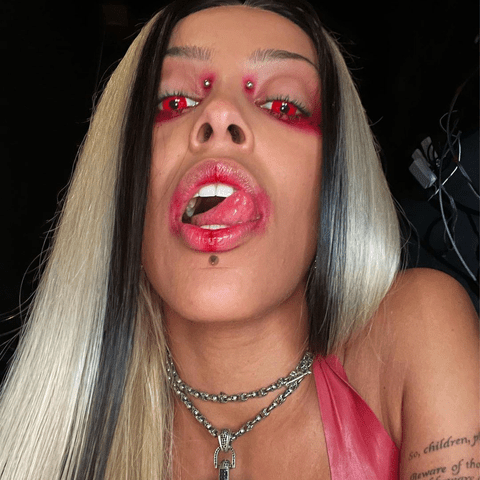 Doja Cat Does Demon-Chic With Marbled Hair and Red Contacts