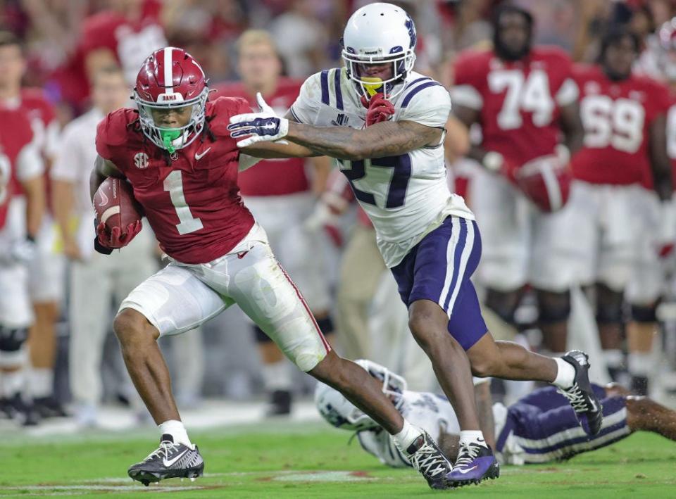 Alabama's Jahmyr Gibbs shakes off Utah State's Hunter Reynolds at Bryant Denny Stadium on Sept. 3, 2022 in Tuscaloosa, Alabama.