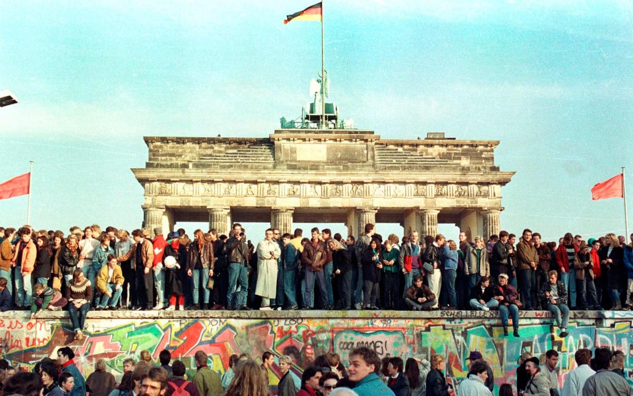 Germans still face a special tax to pay the costs of reunification 30 years after the fall of the Berlin Wall - Reuters