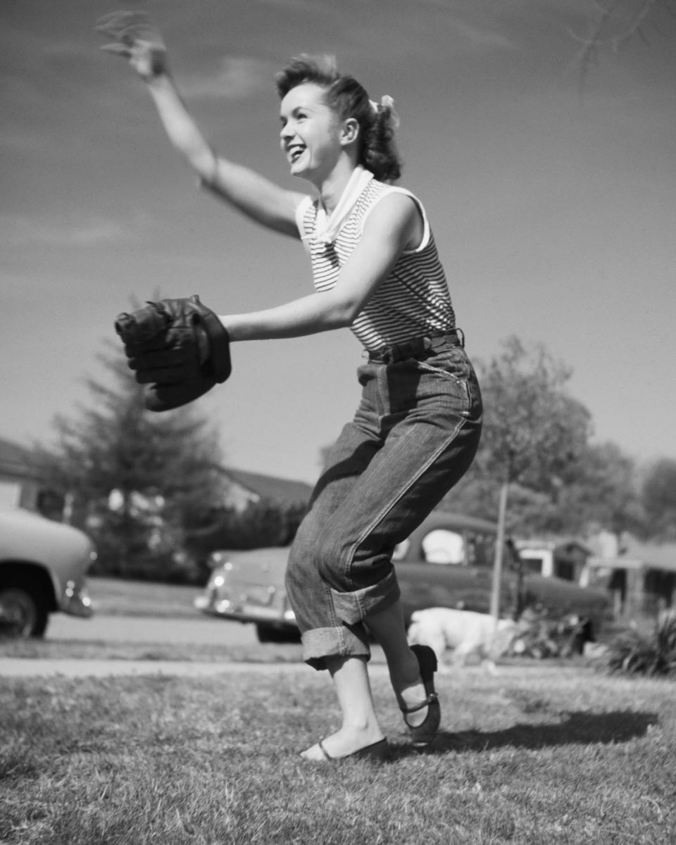 Actress and singer Debbie Reynolds plays baseball, circa 1950.&nbsp;