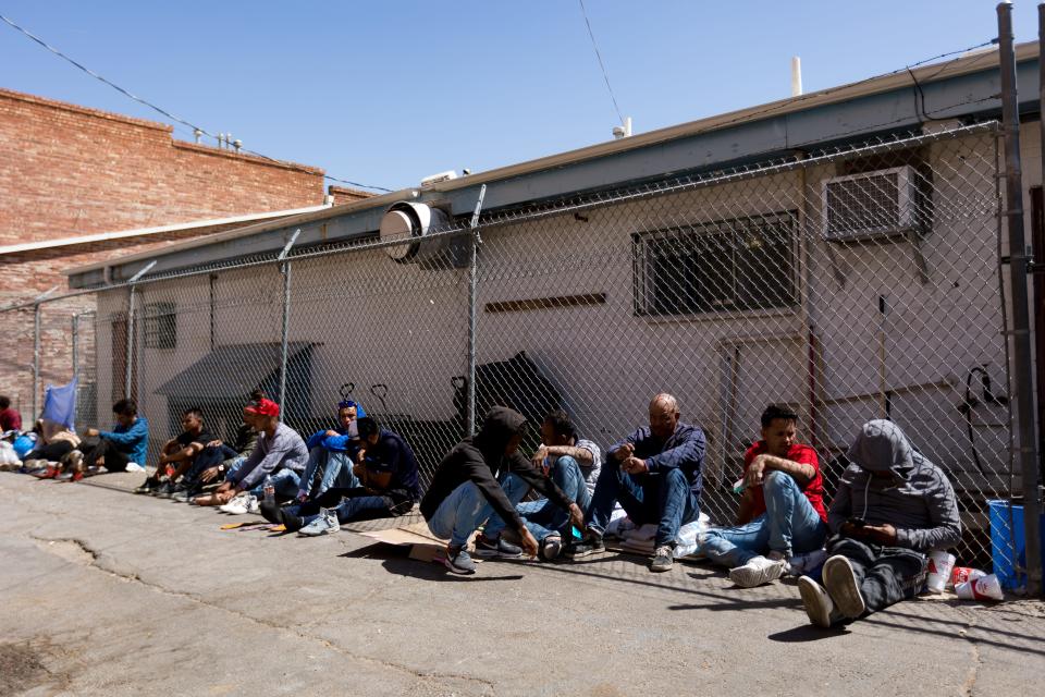 Venezuelan migrants are staying in front and across the street of Sacred Heart Church, on Wednesday, April 26, 2023, after crossing into the U.S.