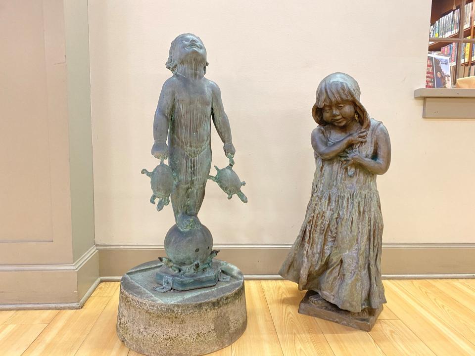 The “Turtle Baby” and Lorann Jacobs’ sculpture of the little girl share a temporary home in the atrium of Martin Library. They will return to their spot in the Sensory Garden at Martin when renovations are done in 2022.