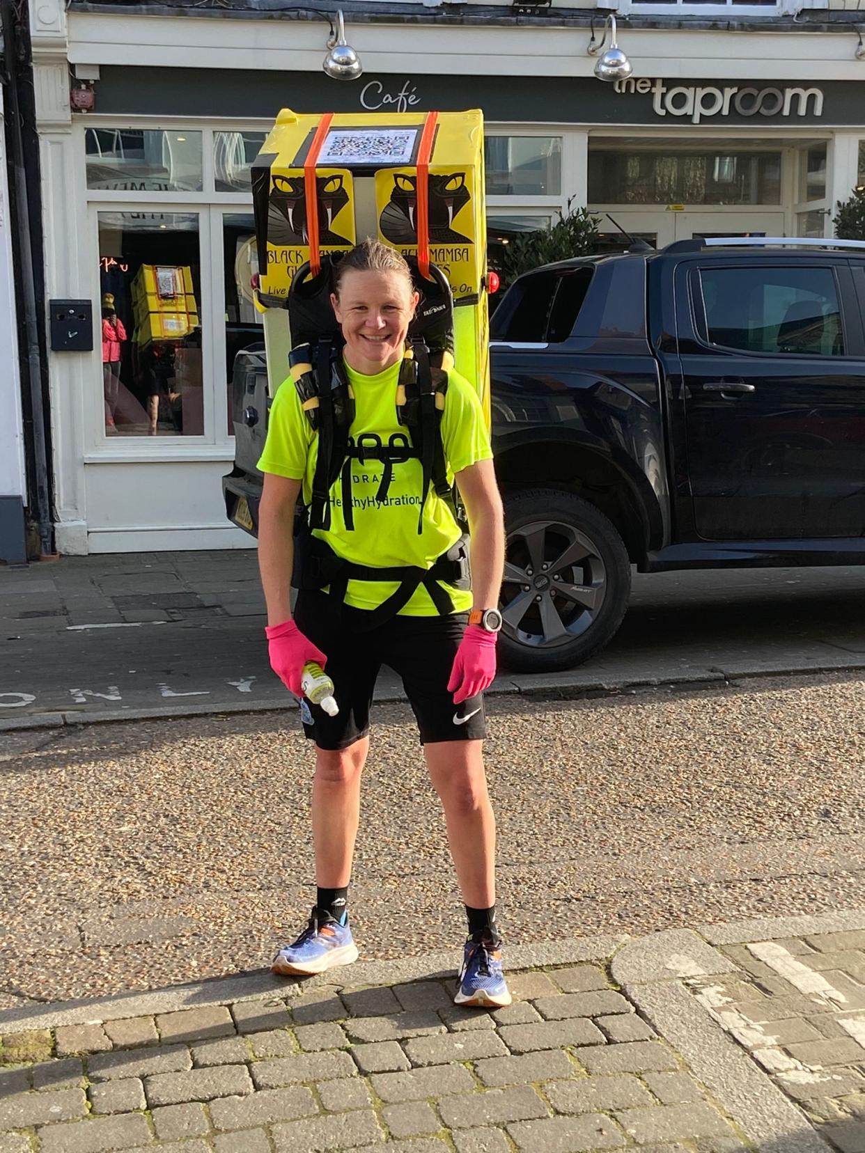 Laura Bird is hoping to break the record for running the marathon while carrying a household appliance (Guinness World Records/PA)