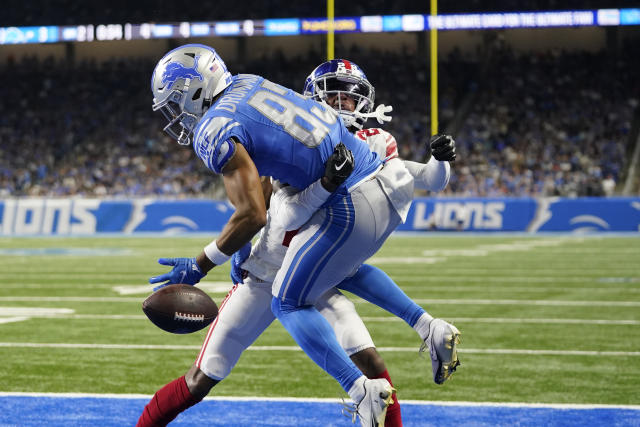 Detroit Lions quarterback Adrian Martinez (18) keeps the ball during the  second half of an NFL