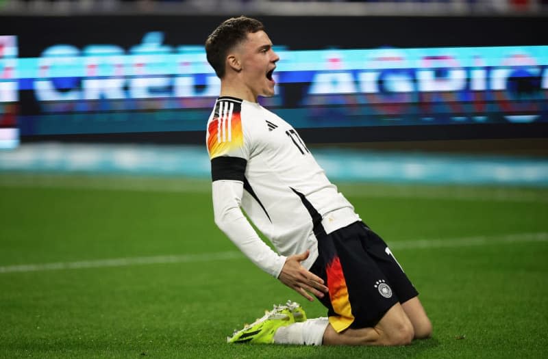 Germany's Florian Wirtz celebrates after scoring his sides first goal of the game during the International friendly soccer match between France and Germany at Groupama Stadium. Christian Charisius/dpa