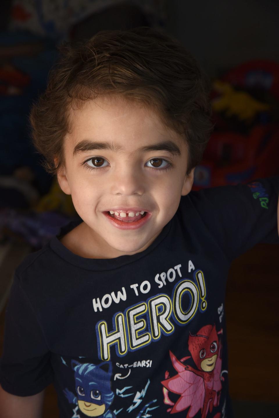 Elliott Althouse, of Monroe, who turns 5 years old today, wears a PJ Masks t-shirt that says, 'How to spot a HERO.' Since he was 2 years old, Elliott has battled a very rare syndrome called Lennox-Gastaut Syndrome, a lifelong and aggressive form of epilepsy.