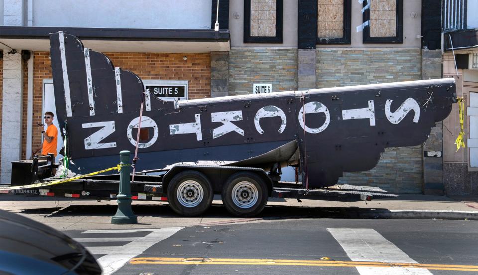 The sign from the Empire (nee Royal) Theater lays on a trailer after being taken down from the theater on Pacific Avenue along the miracle Mile in Stockton on Aug. 2, 2023. According to Ronald J. Barber III vice president of RB Environmental doing the demolition, the plan is to do demolition of the fire-damaged building and the renovate it. The sign is supposed to be used in the refurbished site.