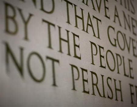 A line from Abraham Lincoln's "Gettysburg Address" is displayed at the Lincoln Memorial ahead of celebrations commemorating the 200th anniversary of Lincoln's birth in Washington February 11, 2009. REUTERS/Joshua Roberts