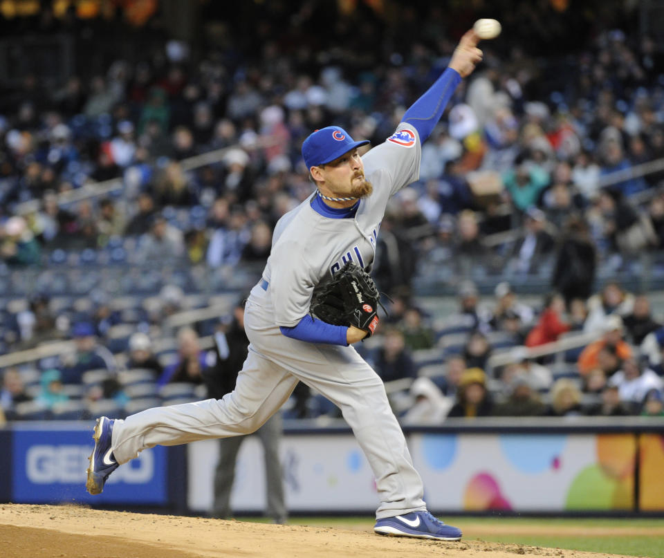 Chicago Cubs pitcher Travis Wood delivers the ball to the New York Yankees during the first inning of Game 2 of an interleague baseball doubleheader on Wednesday, April 16, 2014, at Yankee Stadium in New York. (AP Photo/Bill Kostroun)