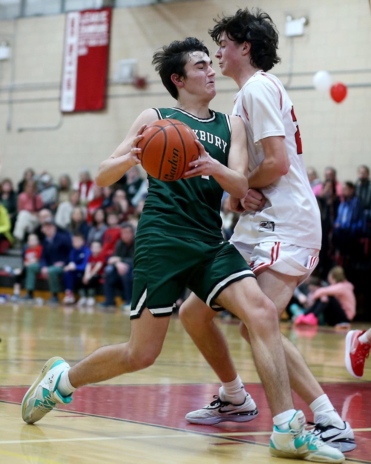 Duxbury's Liam Burns earns a trip to the line after a foul by Hingham’s Charlie Matthews during fourth quarter action of their game against Hingham at Hingham High on Friday, Feb. 10, 2023. 