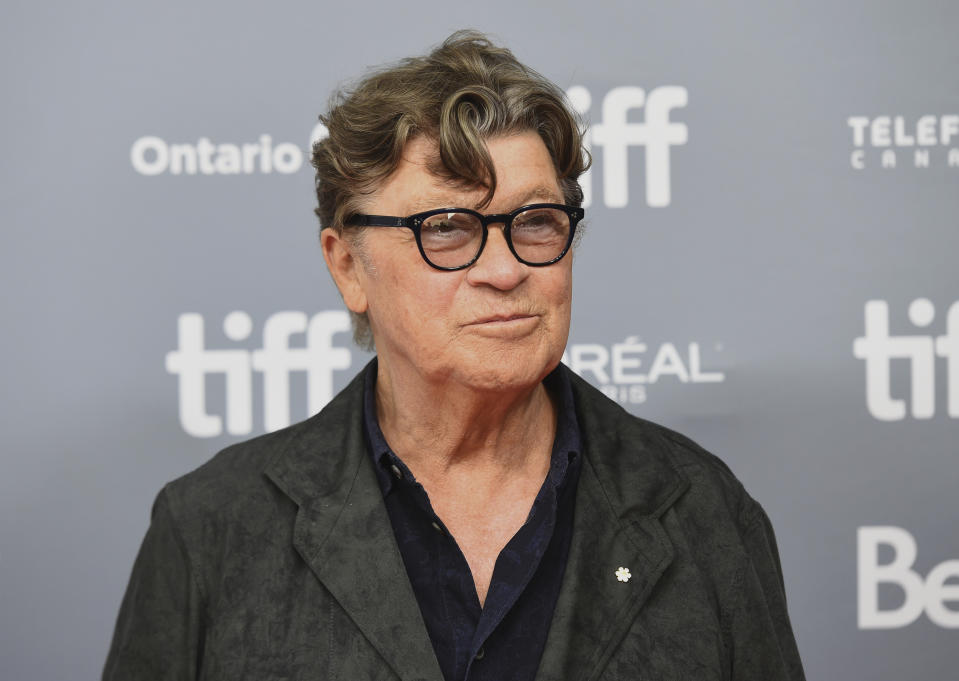 FILE - This Sept. 5, 2019 file photo shows Robbie Robertson at a press conference for "Once Were Brothers: Robbie Robertson and The Band" at the Toronto International Film Festival in Toronto. Robertson has a new album "Sinematic," has scored the upcoming Martin Scorcese film “The Irishman,” is writing a second volume of his memoir “Testimony” and is celebrating the 50th anniversary of The Band’s self-titled album with a new box set. (Photo by Chris Pizzello/Invision/AP, File)