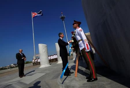 Britain's Foreign Secretary Philip Hammond (C) attends a wreath laying ceremony for Cuba's independence hero Jose Marti at Revolution Square in Havana April 28, 2016. REUTERS/Enrique de la Osa