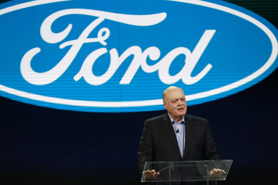 FILE- In this Jan. 14, 2018, file photo Ford President and CEO Jim Hackett prepares to address the media at the North American International Auto Show in Detroit. A new version of the Ford Explorer big SUV will be shown off at the auto show starting Monday, Jan. 14, 2019, and it will have an optional hybrid power system. It is Ford’s first hybrid SUV in six years, and the company also has plans for a fully electric SUV based on the Mustang sometime next year. Seven battery-powered vehicles are planned for the U.S. by 2022, even a hybrid pickup truck. (AP Photo/Carlos Osorio, File)