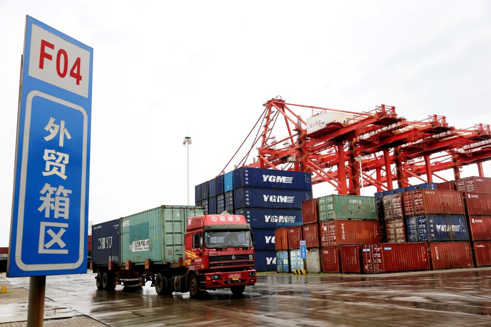 A truck transports containers at a container terminal in Lianyungang, east China's Jiangsu Province, July 13, 2021. China's foreign trade in the first half of the year posted the best performance in history, underpinned by the country's sustainable economic recovery and strong global demand. The country's foreign trade rose 27.1 percent year on year to 18.07 trillion yuan about 2.79 trillion U.S. dollars in the first six months, showed data from the General Administration of Customs GAC on Tuesday. (Photo by Wang Chun/Xinhua via Getty Images)