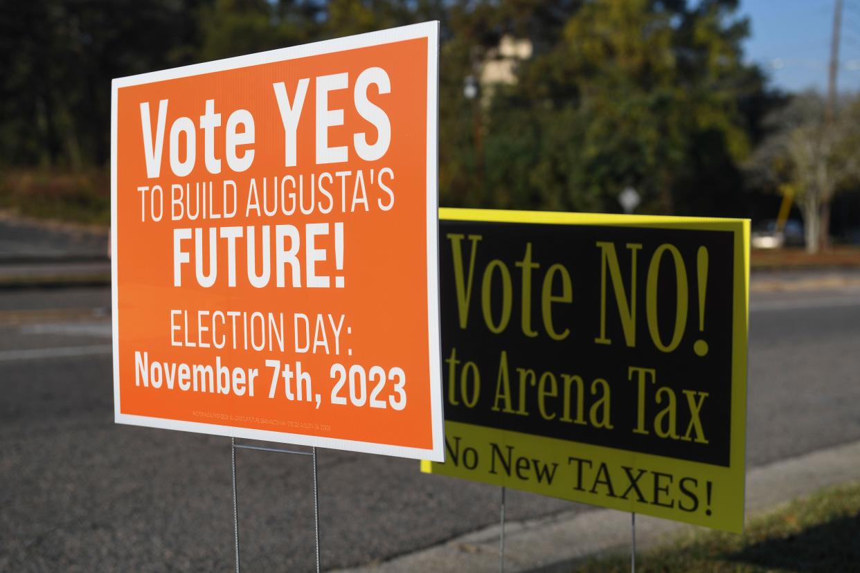 Signs for the James Brown Arena tax sit outside the Julian Smith Casino on Tuesday, Nov. 7, 2023.