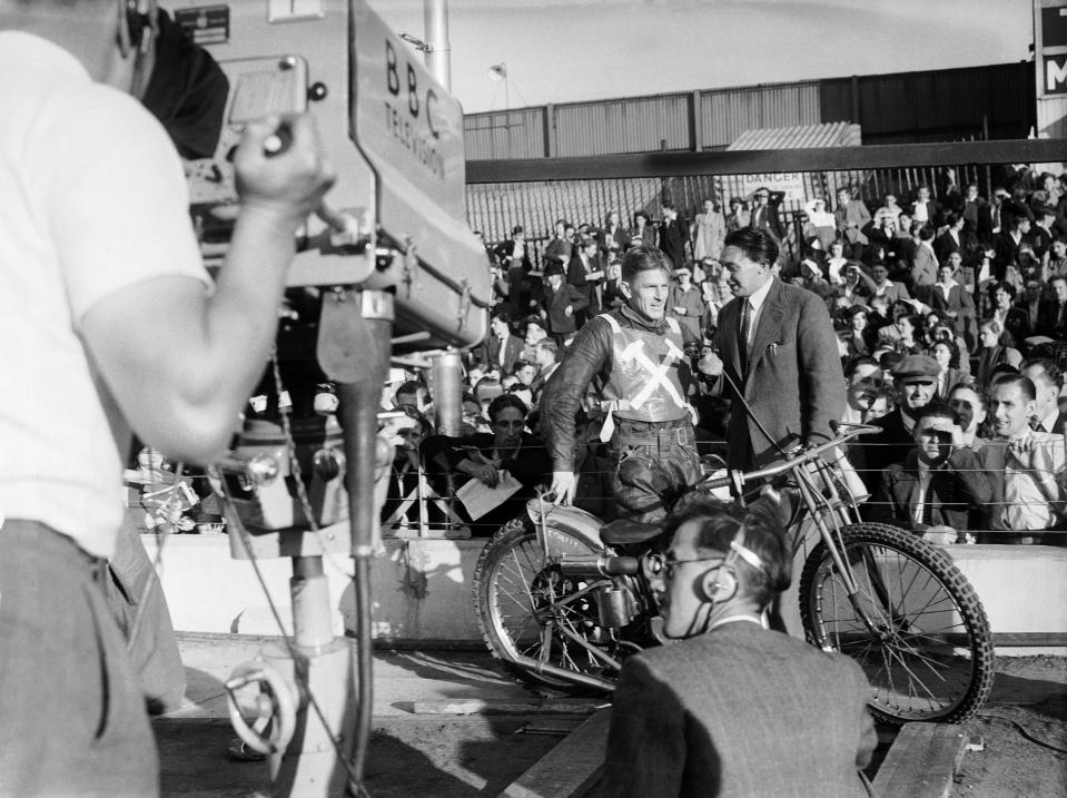 West Ham Speedway team Captain Eric Chitty is interviewed before a television camera before the race as his team take on Brimingham Speedway team at West Ham, 21s June 1950.