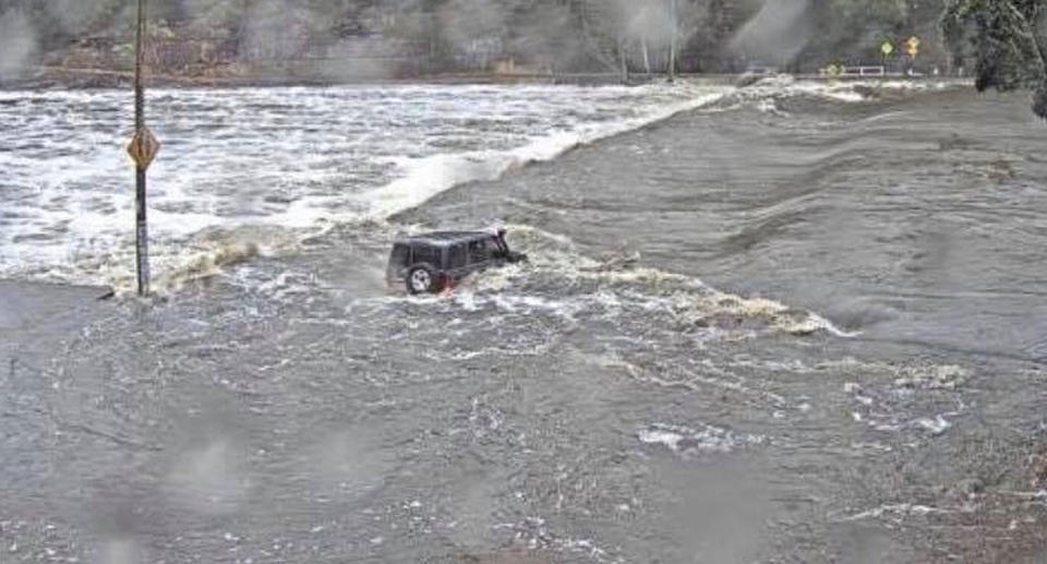 Harrowing photo of car in deep floodwaters sparks panic