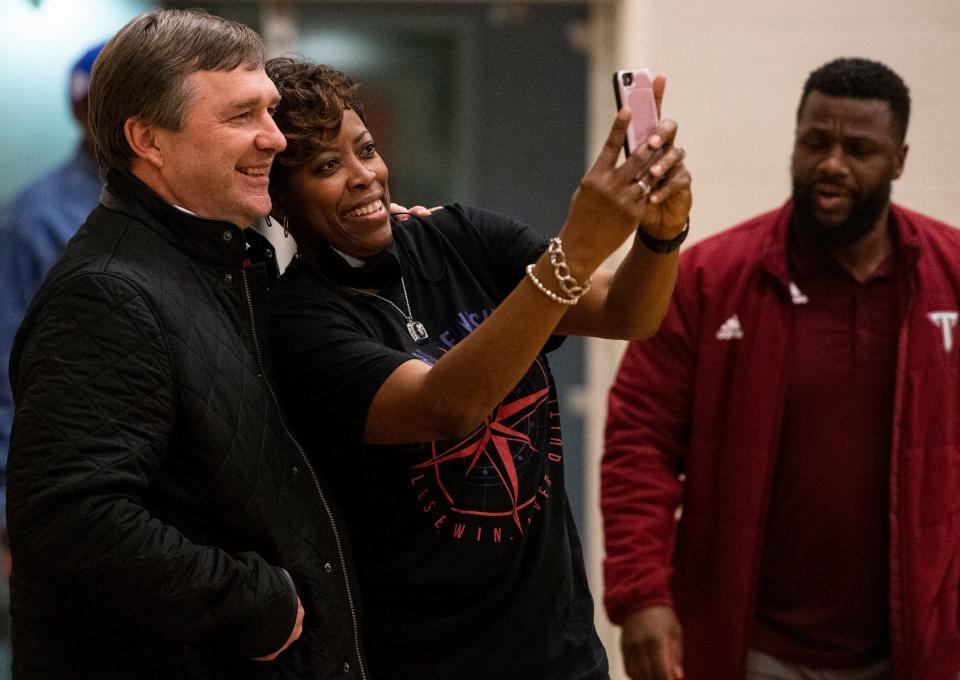 Georgia football head coach Kirby Smart takes a photo as Carver boys take on Lee at Carver High School in Montgomery, Ala., on Tuesday, Jan. 18, 2022.