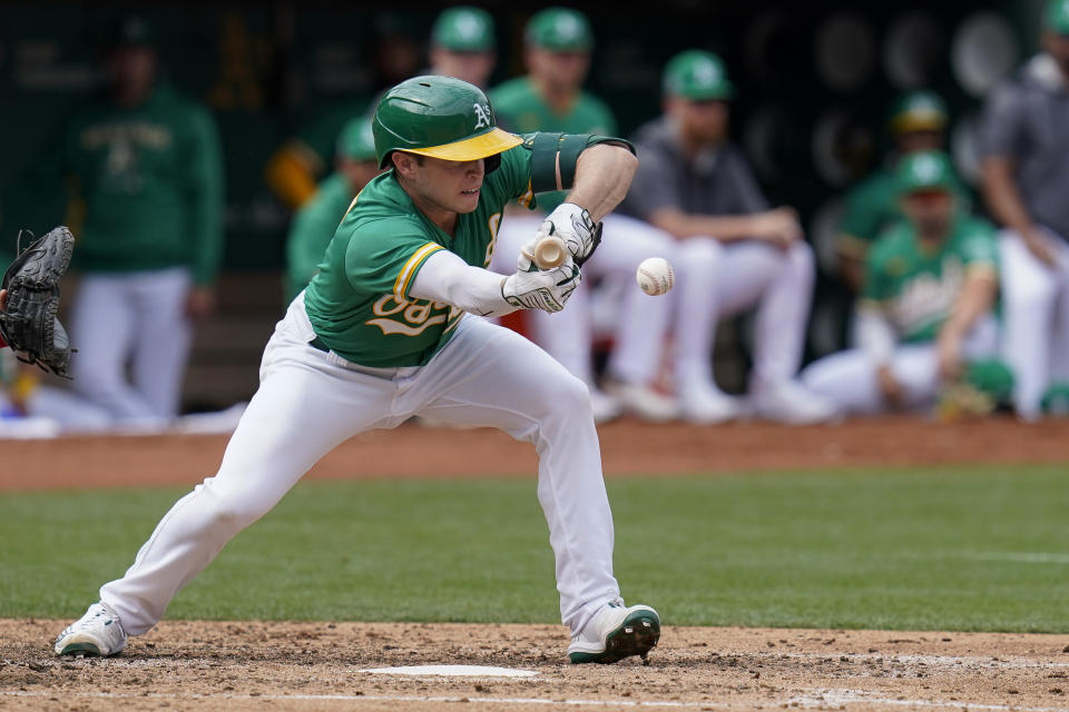 Oakland Athletics' Nick Allen lays down a sacrifice bunt against the Chicago White Sox during the fifth inning of a baseball game in Oakland, Calif., Sunday, Sept. 11, 2022. (AP Photo/Godofredo A. Vásquez)