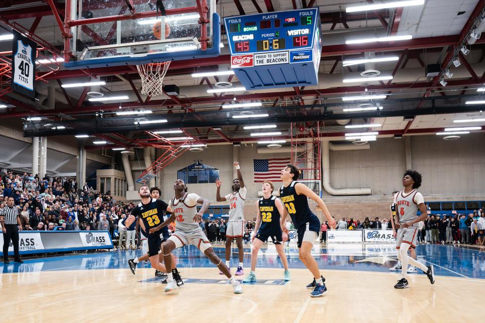 Both teams watch as Teshaun Steele's second free throw lands with .6 seconds left to tie Xaverian Brothers and force overtime during a D1 state semifinal at UMass Boston on Wednesday March 13, 2024.