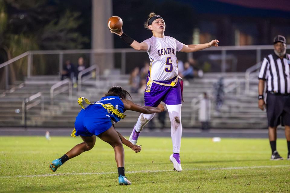 Fort Pierce Central’s Adrienne Rivera (5) throws the ball while avoiding an opponent in a high school flag football game at Martin County, Thursday, Feb. 29, 2024.