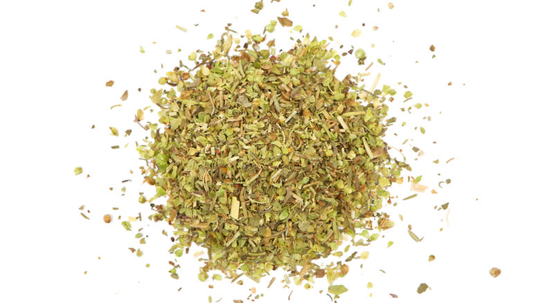 pile of oregano on white background