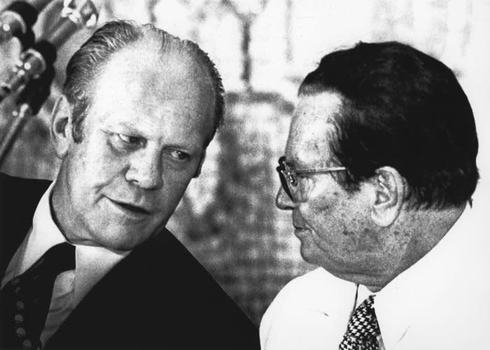 President Gerald Ford (L) leans over to chat with Josip Broz Tito, the president of Yugoslavia in Belgrade, during state dinner on August 3, 1975, during his official visit to the country. UPI File Photo