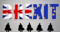 FILE PHOTO: Small toy figures are seen in front of a Brexit logo in this illustration picture