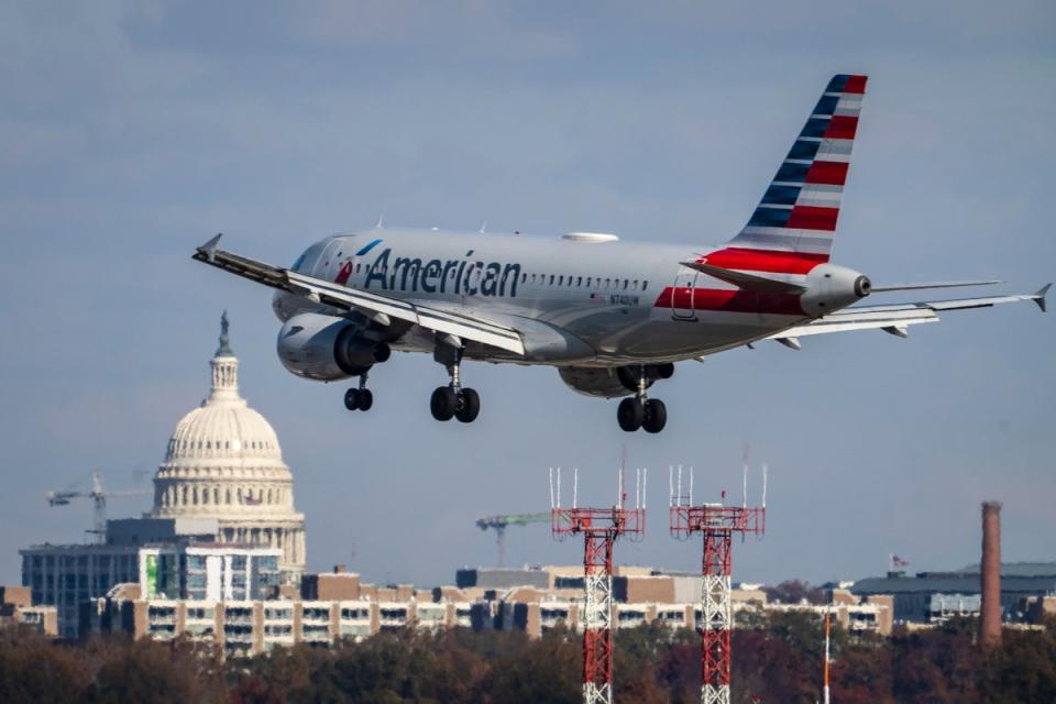 An American Airlines flight pictured landing at the Ronald Reagan Washington National Airport outside of Washington, DC. An American Airlines flight almost collided with a private plane on Wednesday morning after both flights were cleared to use intersecting runways (Getty Images)
