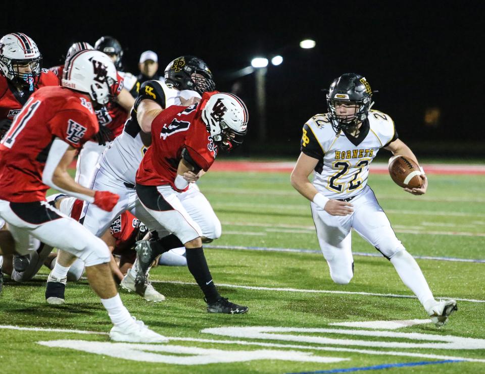 Hanover Park's Michael Filippone runs the ball during the first half of a football game at West Essex High School on November 25, 2020. Alexandra Pais/ For the Daily Record