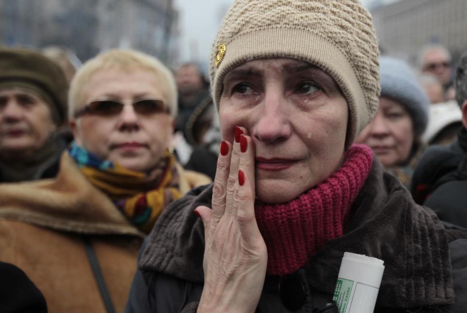 A woman reacts, during a rally in Kiev's Independence Square, Sunday, March 2, 2014. Ukraine's new prime minister urged Russian President Vladimir Putin to pull back his military Sunday in the conflict between the two countries, warning that "we are on the brink of disaster." The comments from Arseniy Yatsenyuk came as a convoy of Russian troops rolled toward Simferopol, the capital of Ukraine's Crimea region, a day after Russian forces took over the strategic Black Sea peninsula without firing a shot. (AP Photo/Sergei Chuzavkov)