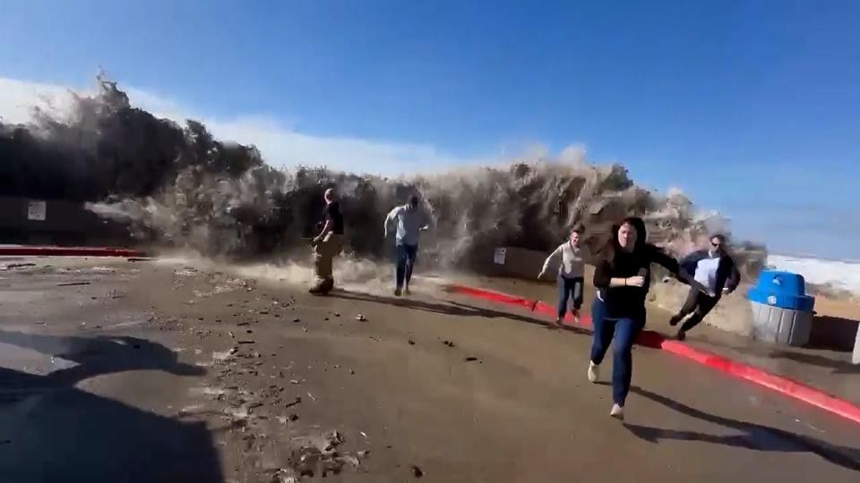 People scatter as rogue wave jumps seawall