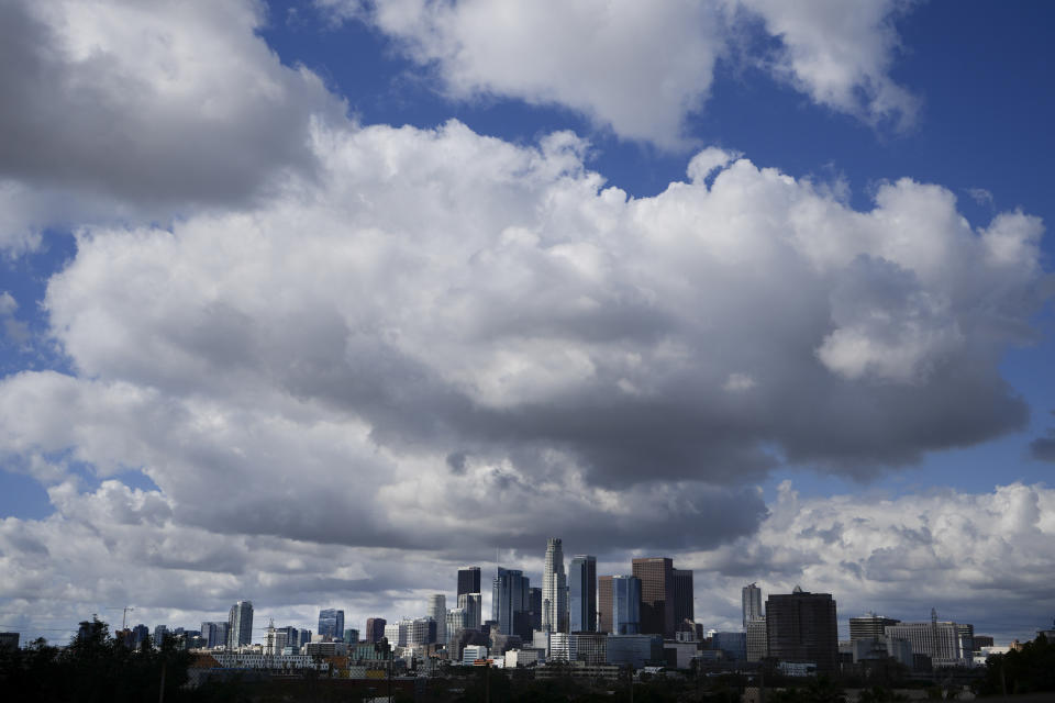 Clouds hover over the Los Angeles skyline, Wednesday, Feb. 7, 2024, in this view from Hacienda Heights, Calif. (AP Photo/Damian Dovarganes)