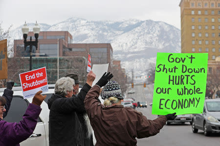 FILE PHOTO: U.S. Internal Revenue Services (IRS) employees rally in front of the Federal Building against the ongoing U.S. federal government shutdown, in Ogden, Utah, U.S., January 10, 2019. REUTERS/George Frey