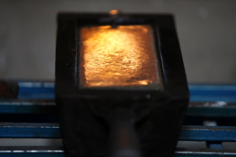 A gold ingot is seen during the refining process at AGR (African Gold Refinery) in Entebbe