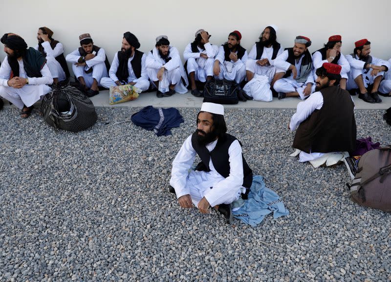 Newly freed Taliban prisoners sit at Pul-i-Charkhi prison, in Kabul, Afghanistan