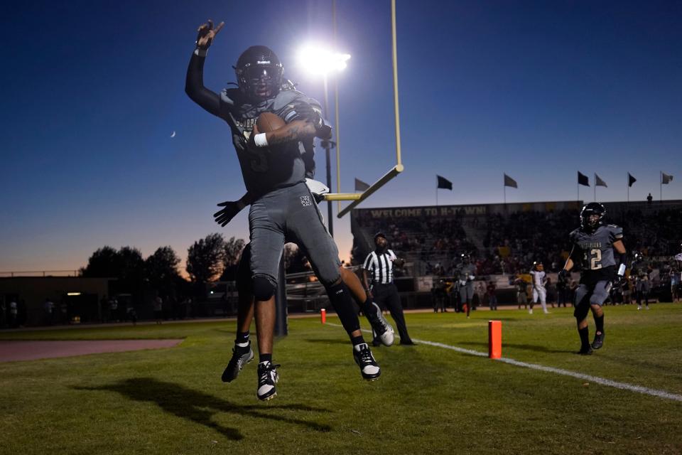 Hesperia’ Anthony Lopez jumps in celebration after scoring a touchdown during the second quarter against Barstow on Friday, Aug. 18, 2023.