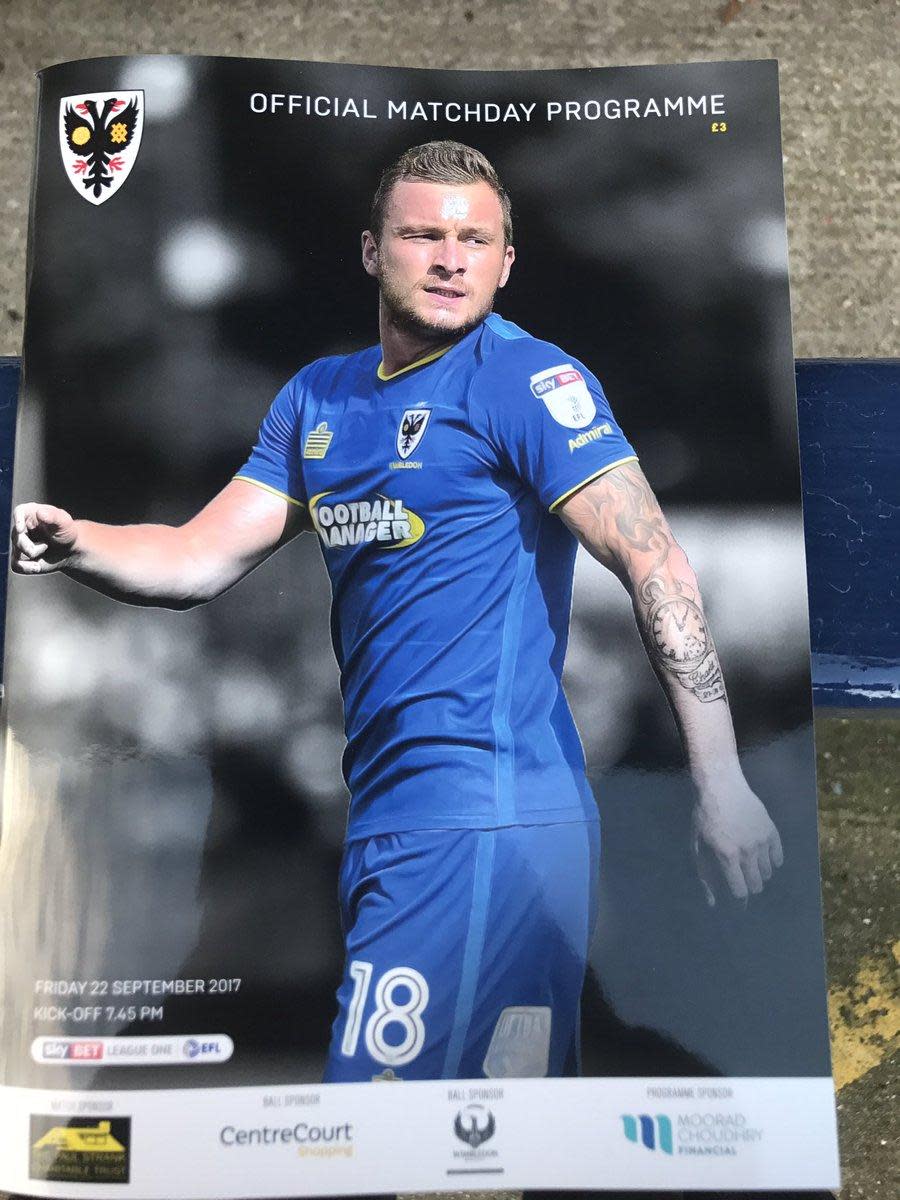 Snub | A programme from a League One meeting between AFC Wimbledon and MK Dons, the latter not being referred to