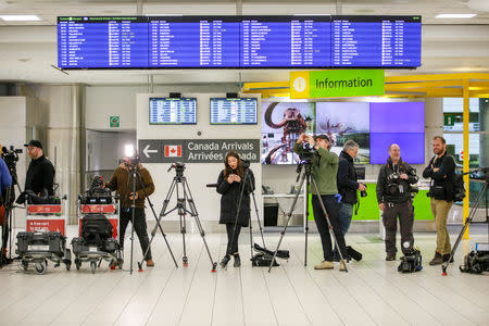 Media staff prepare for the arrival of Rahaf Mohammed al-Qunun at Toronto Pearson International Airport in Toronto, Ontario, Canada January 12, 2019. REUTERS/Carlos Osorio