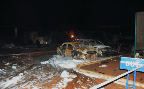 Wreckage of cars are seen at the explosion site of a fuel station in north Accra - Credit:  Xinhua/REX/Shutterstock