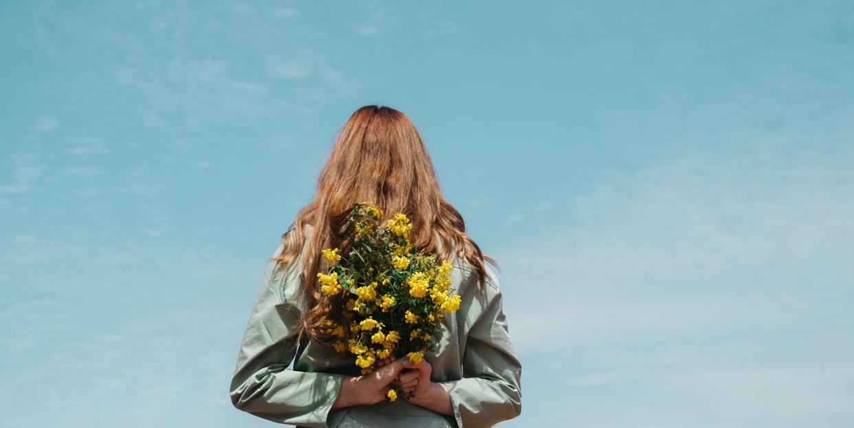 a person holding a bouquet of flowers