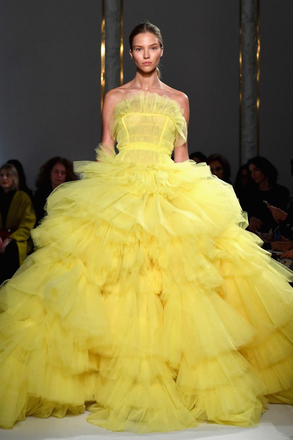 <p>If you’re brave enough to wear yellow you could look like a ray of sunshine in this ruffled gown. [Photo: Getty] </p>